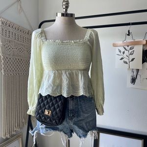 Light green smocked eyelet top.